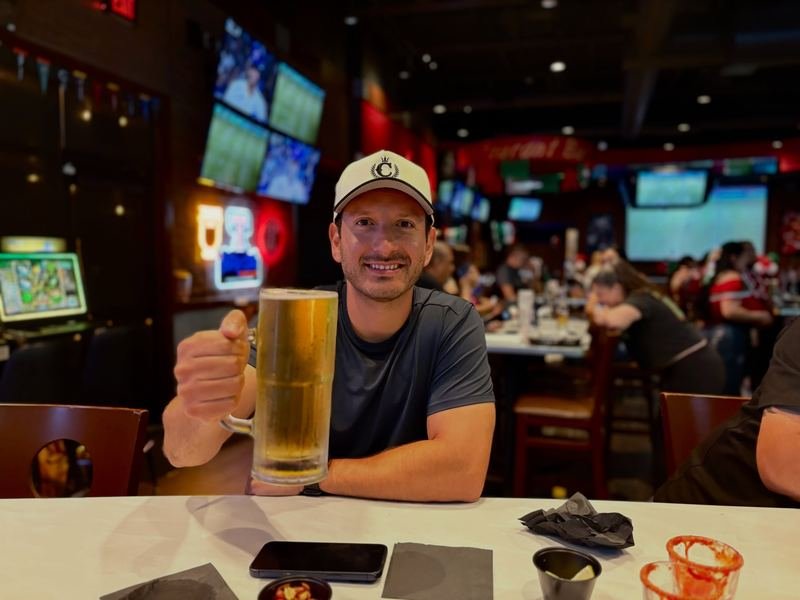 Cheers!: Raising a cold one in front of the big screens.